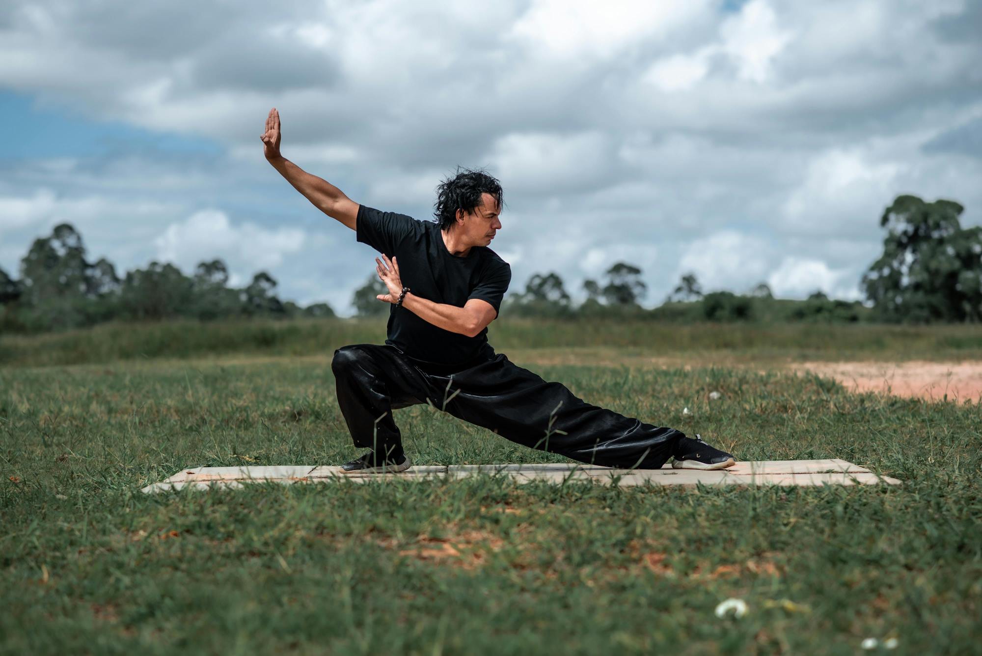 Man practicing tai chi outdoors
