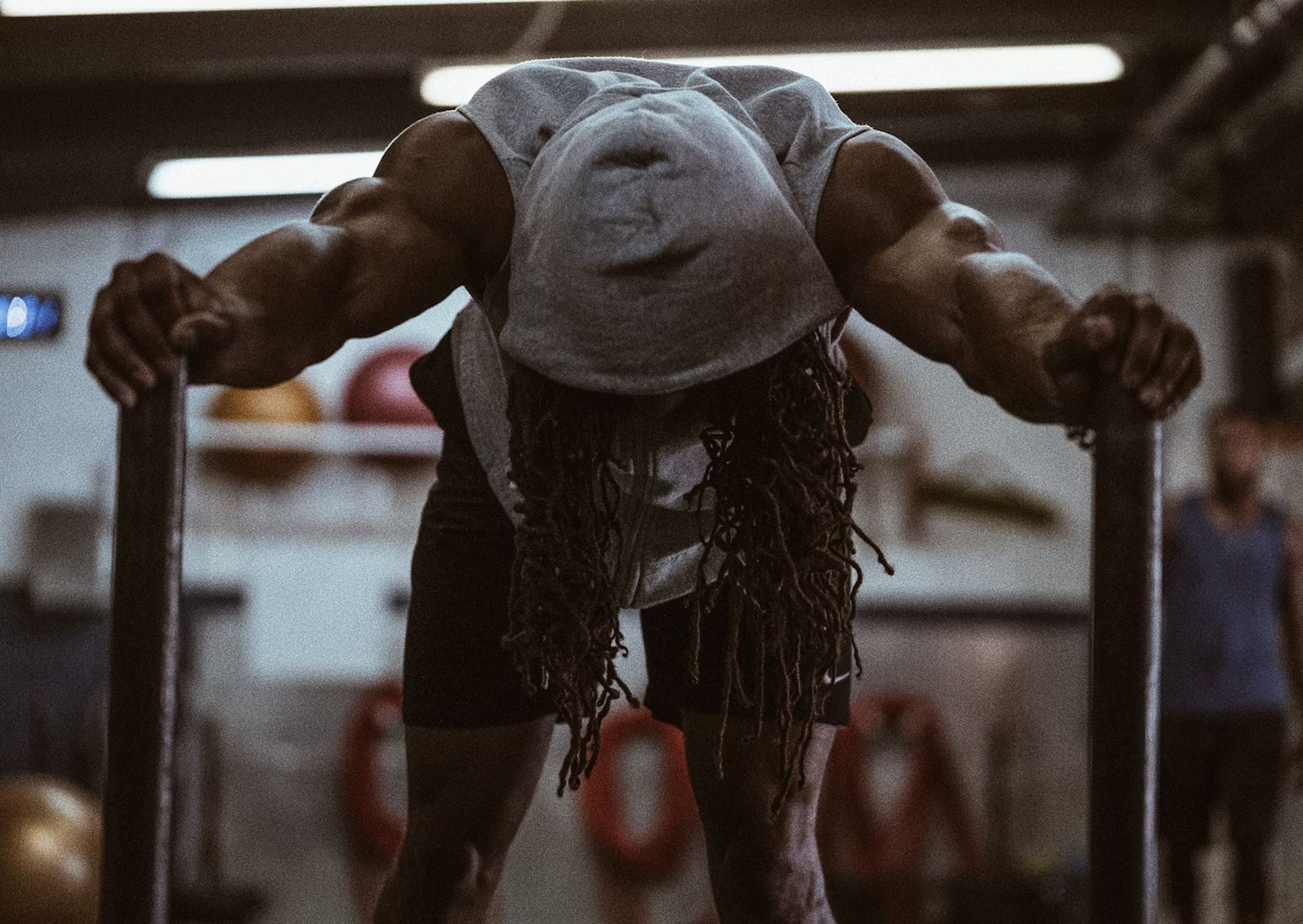 Man exercising wearing a workout tank